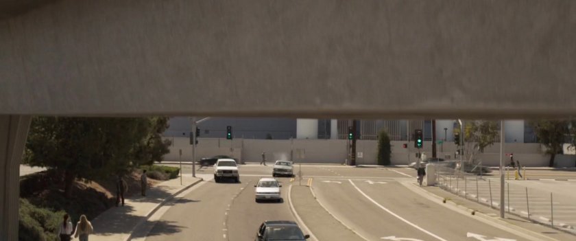 Nick Fury's car racing around corner on Los Angeles street.