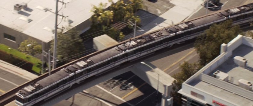 Aerial view of Metro Train on overpass.