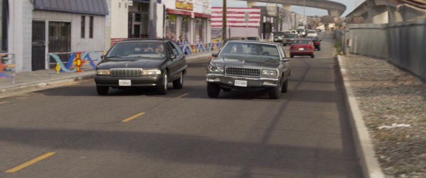 Fury's car swerves onto the wrong side of the road during pursuit of Metro train.