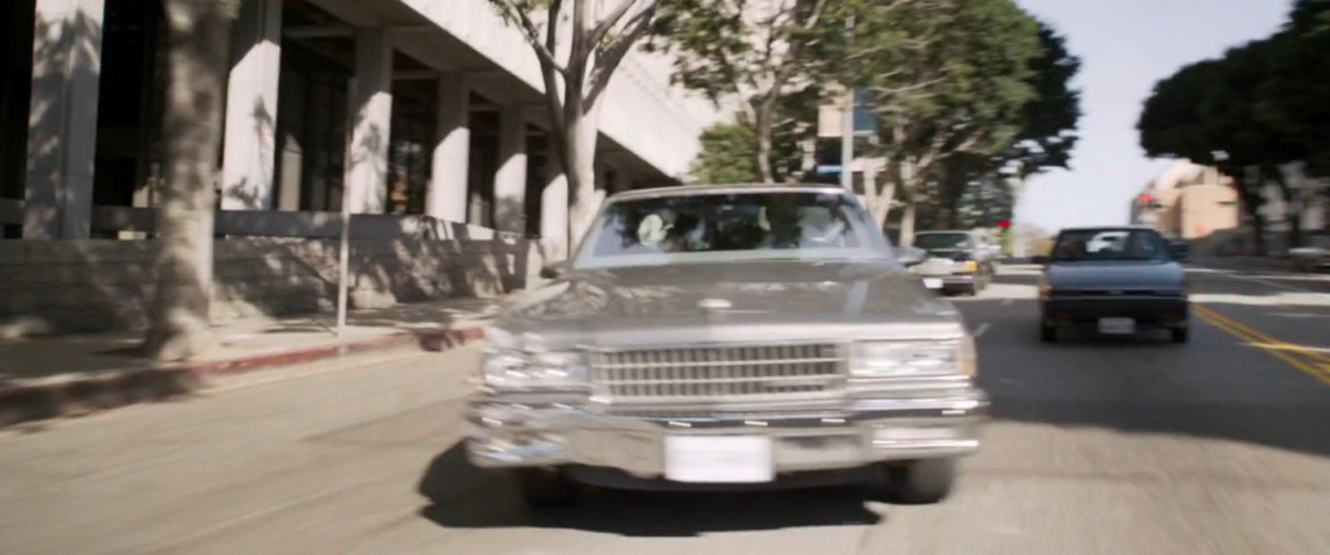 Fury's car swerves on Los Angeles street as he is attacked by a Skrull posing as Coulson.