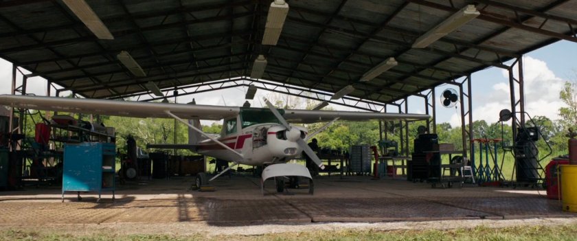 Exterior of Maria Rambeau's covered airplane hangar.