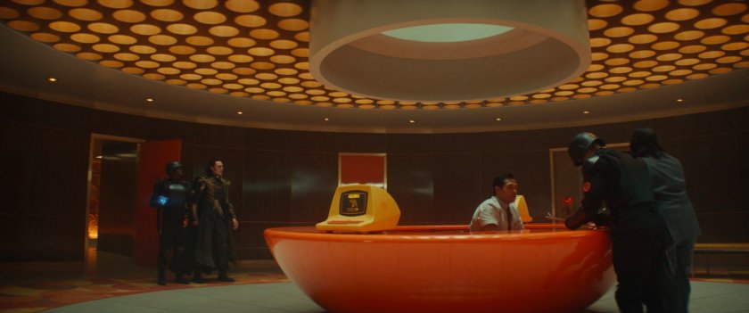 Loki escorted into TVA arrival bay.