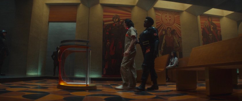 Loki being led inside the TVA Time Court.