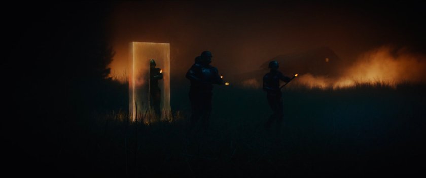 TVA Hunters stepping through time door into Oklahoma field.