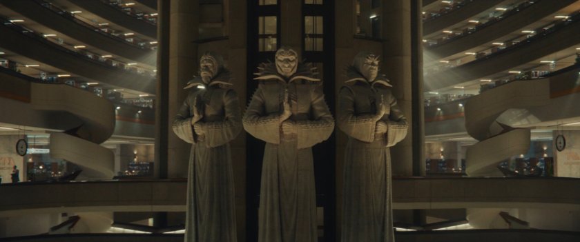 Three Time Keeper statues inside the TVA Archives.