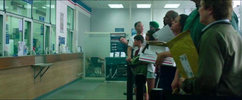 Crowd inside a small New York post office.