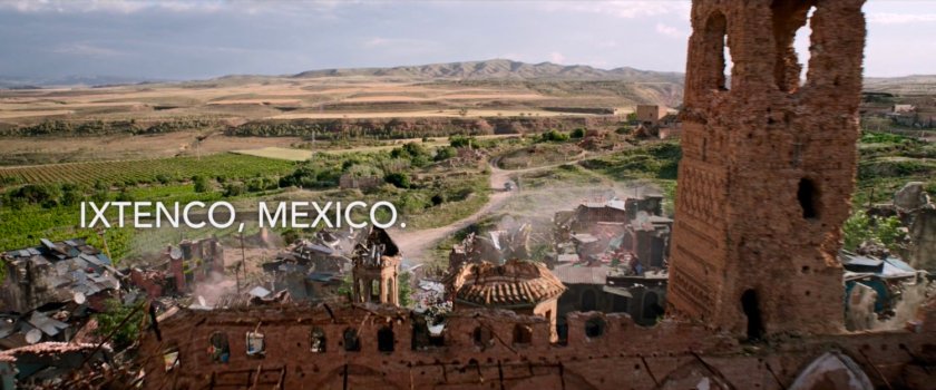 Destroyed small town with desert in background. Text: Ixtenco, Mexico.