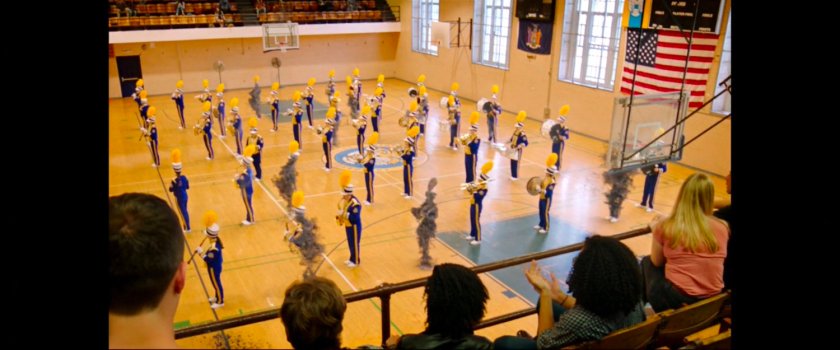 Marching Band performs inside the Midtown High gymnasium.