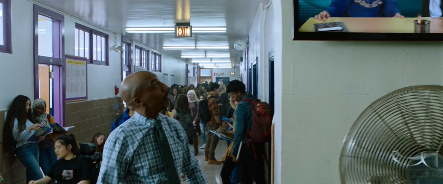 Teachers and students in the hall of Midtown High.