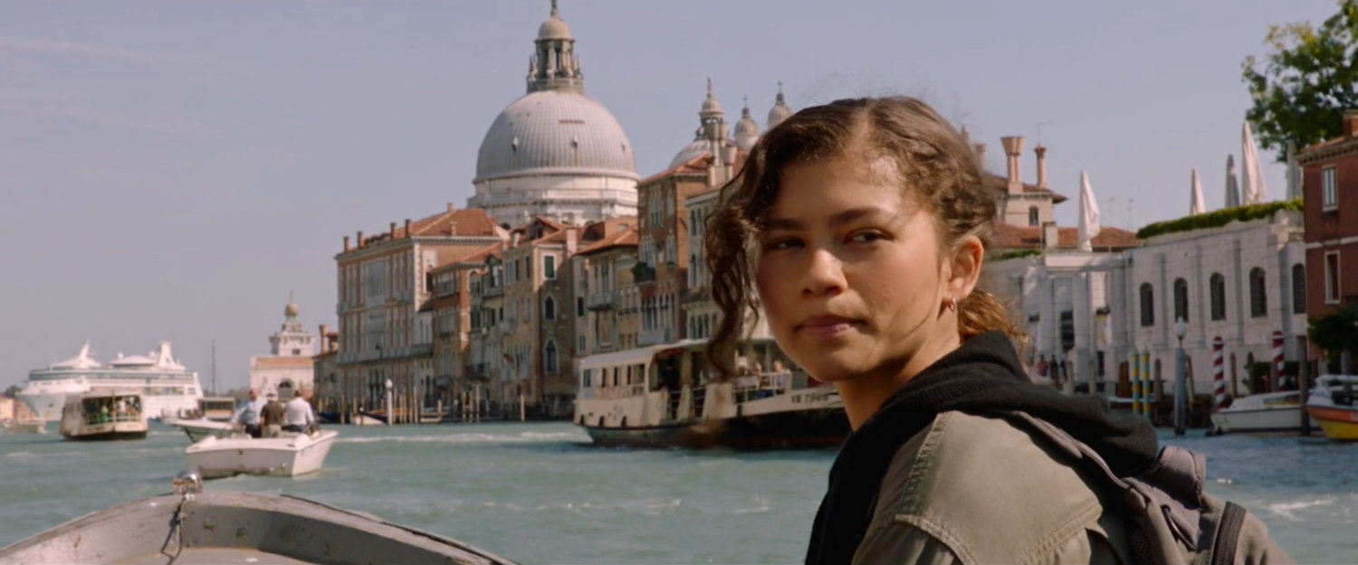 Michelle on a boat passing the Santa Maria della Salute in Venice.