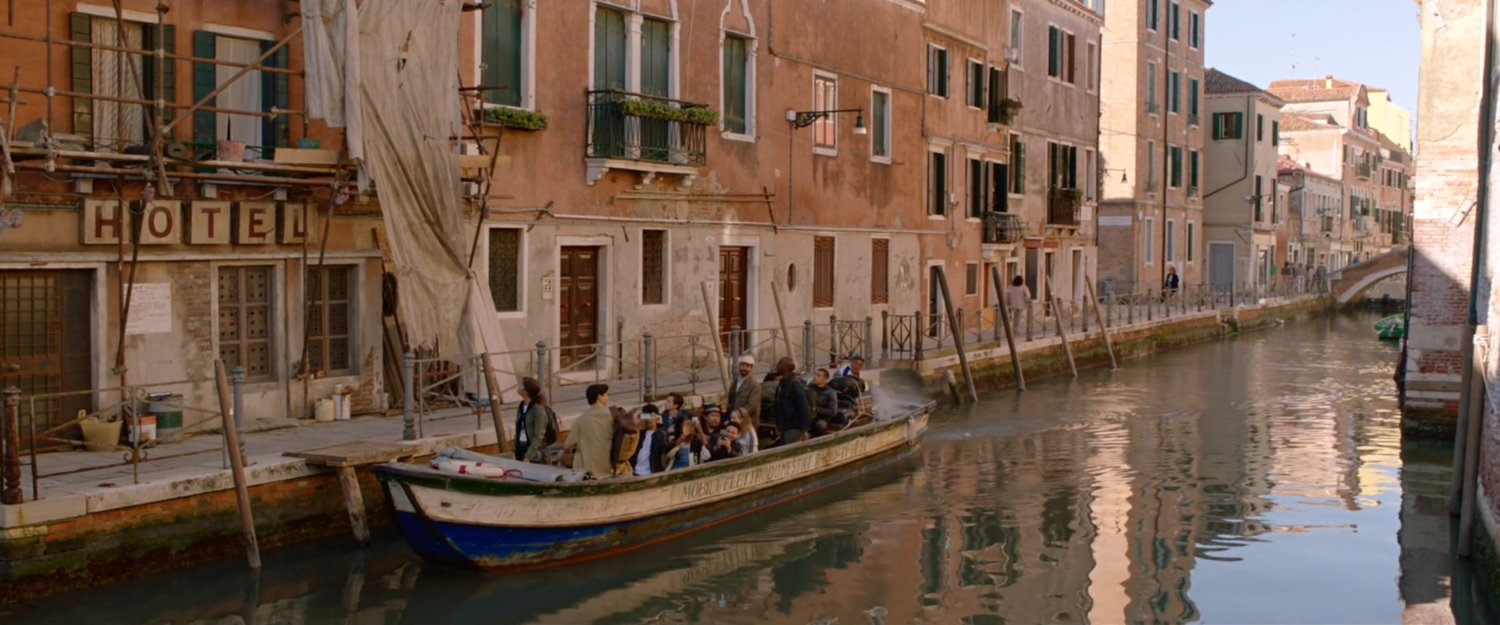 A boat full of students pulls up in front of the Hotel DeMatteis in Venice.