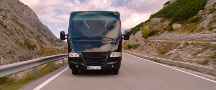 Tour bus on mountain road.