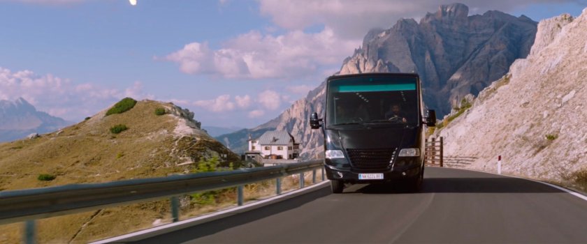 Tour bus on mountain road.
