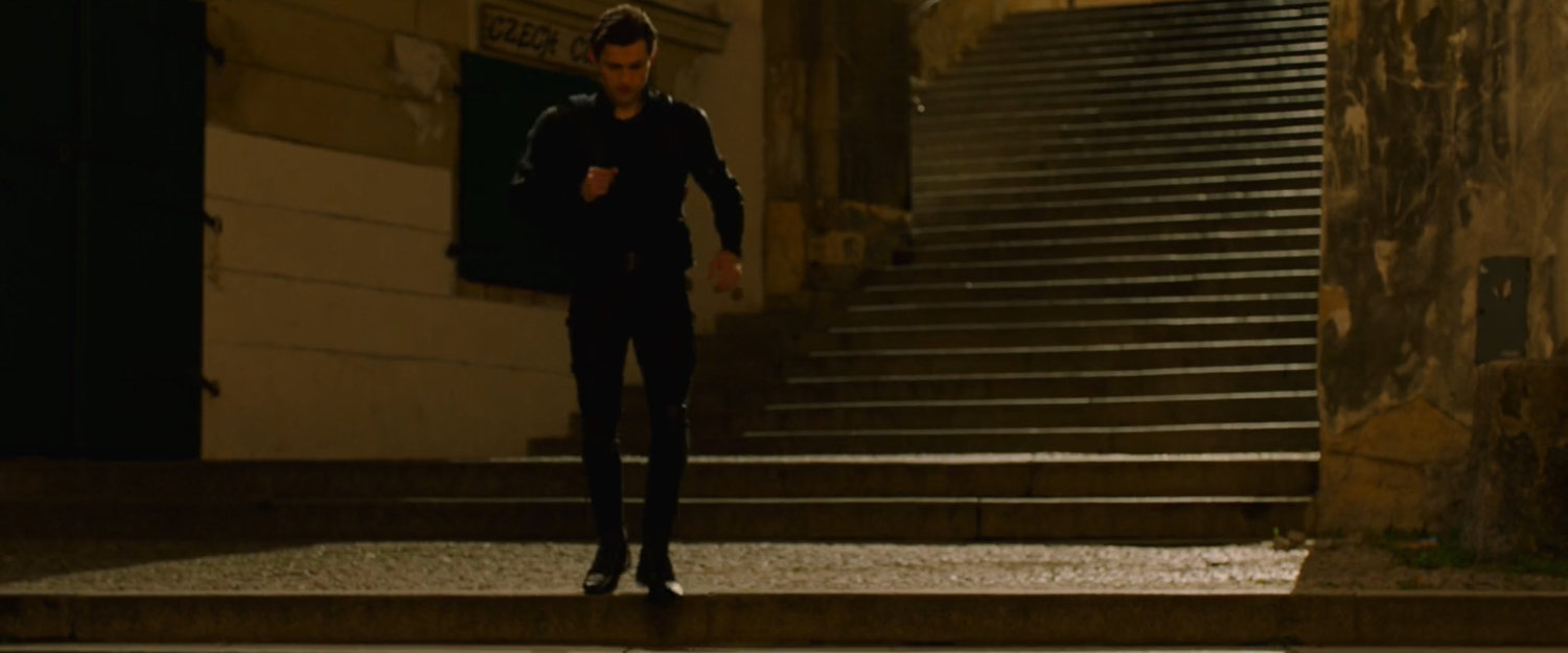 Peter Parker walking down a staircase in Prague.