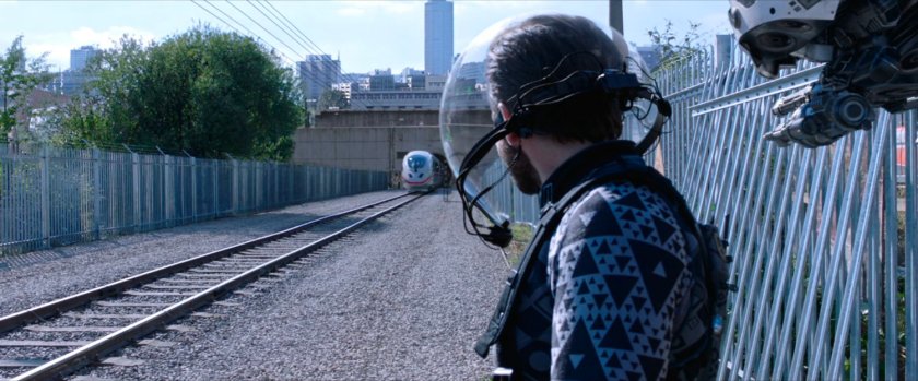 Quentin Beck watches train enter tunnel.