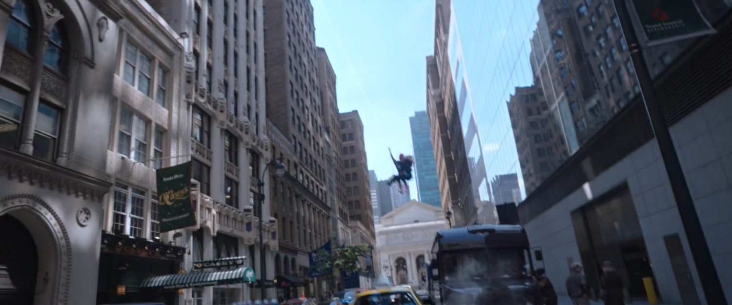 Spider-Man with Michelle swing down New York street.