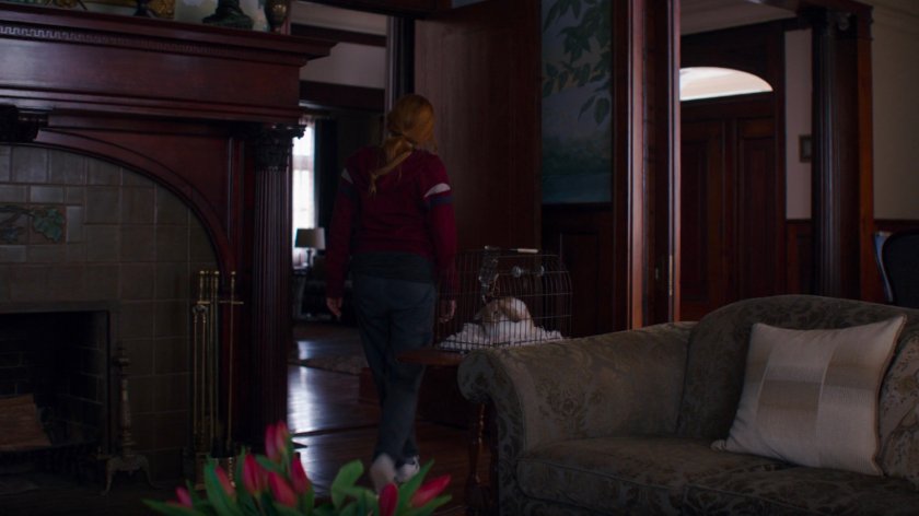 Wanda looking around the inside of Agnes's living room.