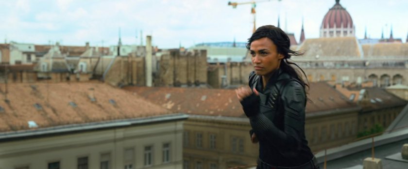 A Black Widow agent running across the rooftops of Budapest.
