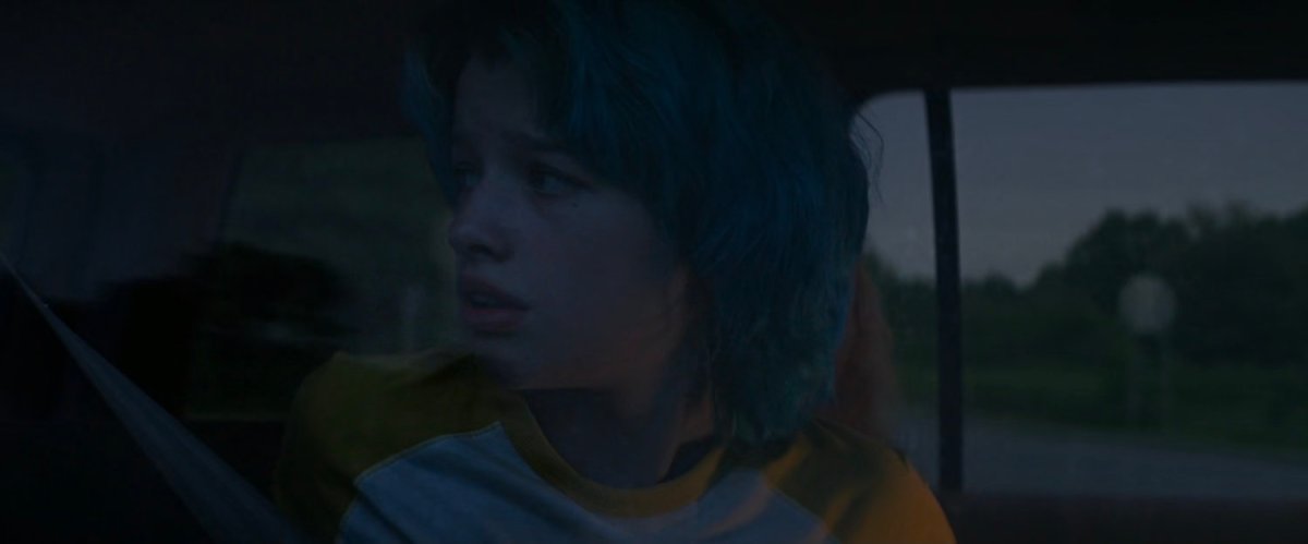 Young Natasha in back of car.