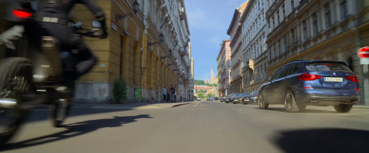 A motorcycle races down a Budapest street.