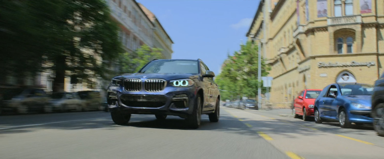 A car races down a Budapest street.