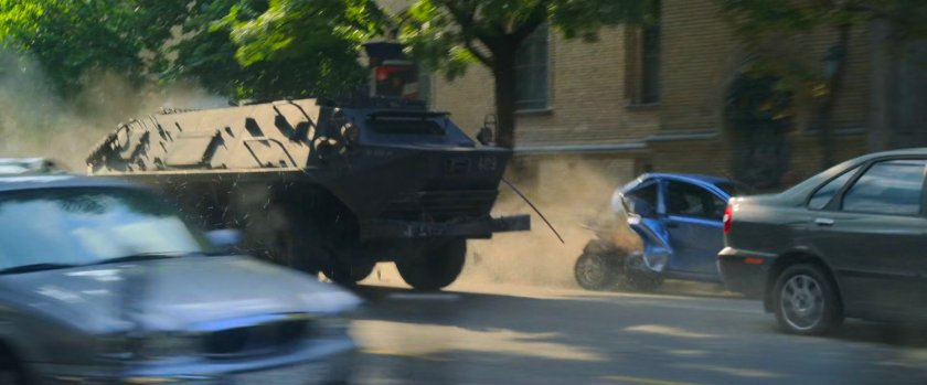An APC crashes through cars on a Budapest street.