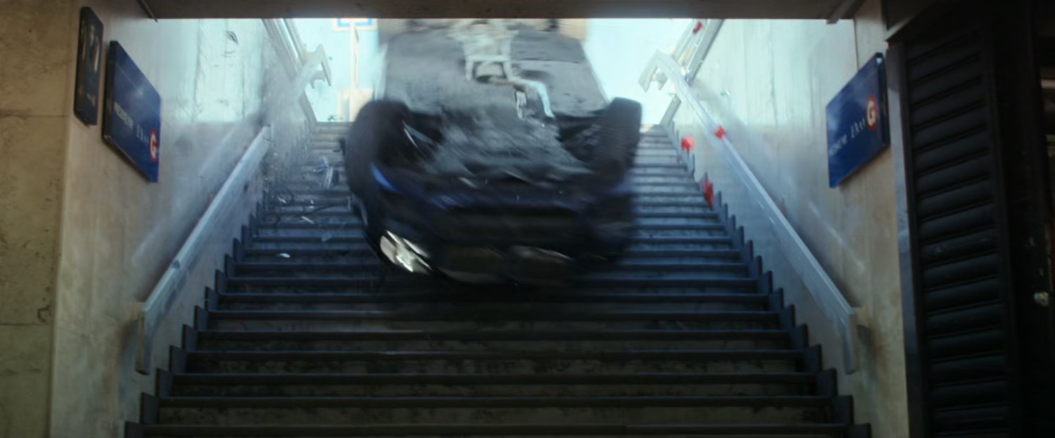 A car slides down the stairs of a subway entrance in Budapest.