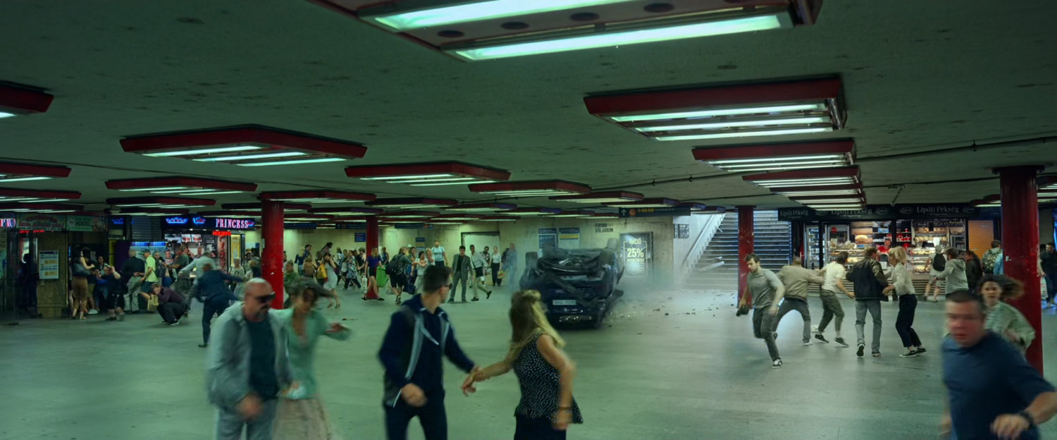 Civilians flee as a car slides into a Budapest subway.