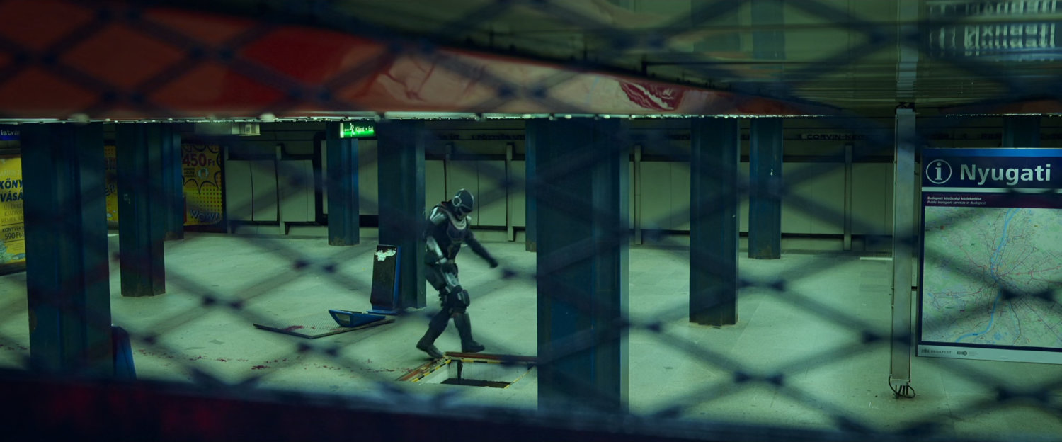 View of Taskmaster in Budapest subway from POV in vent grate.
