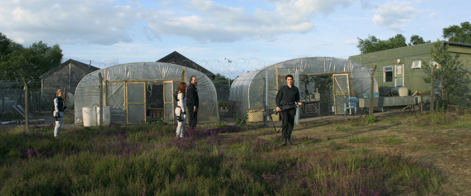 Melina, Dimitri, Yelena, and Natasha outside Melina's homestead.