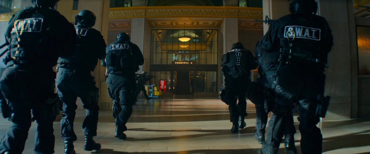 SWAT team members storm a train terminal.