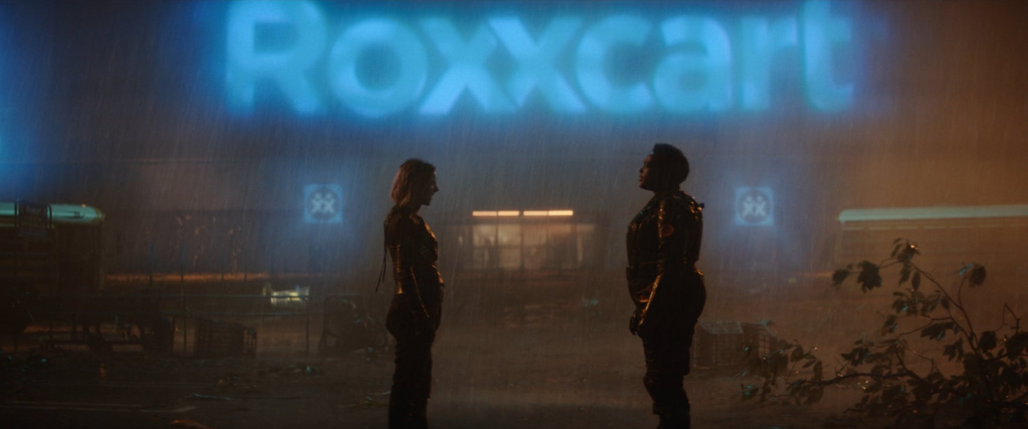 Sylvie and Hunter B-15 in the rain outside Roxxcart Store.