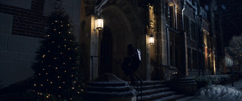 Kate entering college campus building.