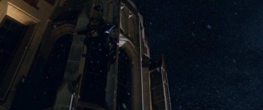 Kate climbing outside of college campus building.