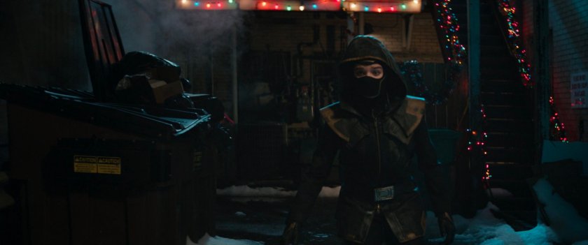 Kate dressed as Ronin in hotely alley.