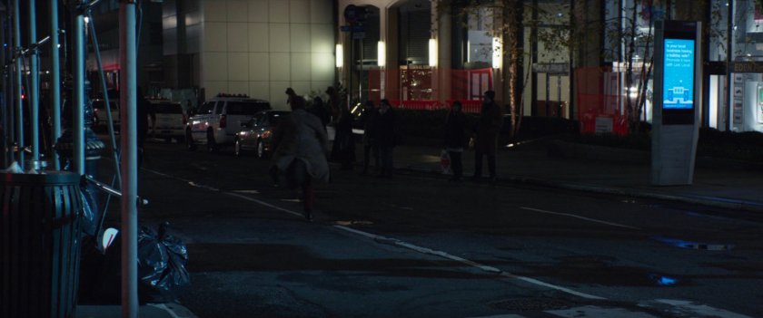 Track suit mafia members run away from a New York intersection.