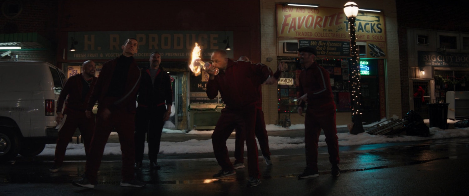 Tracksuit mafia light molotov cocktails outside Herman's Hearty Slice.