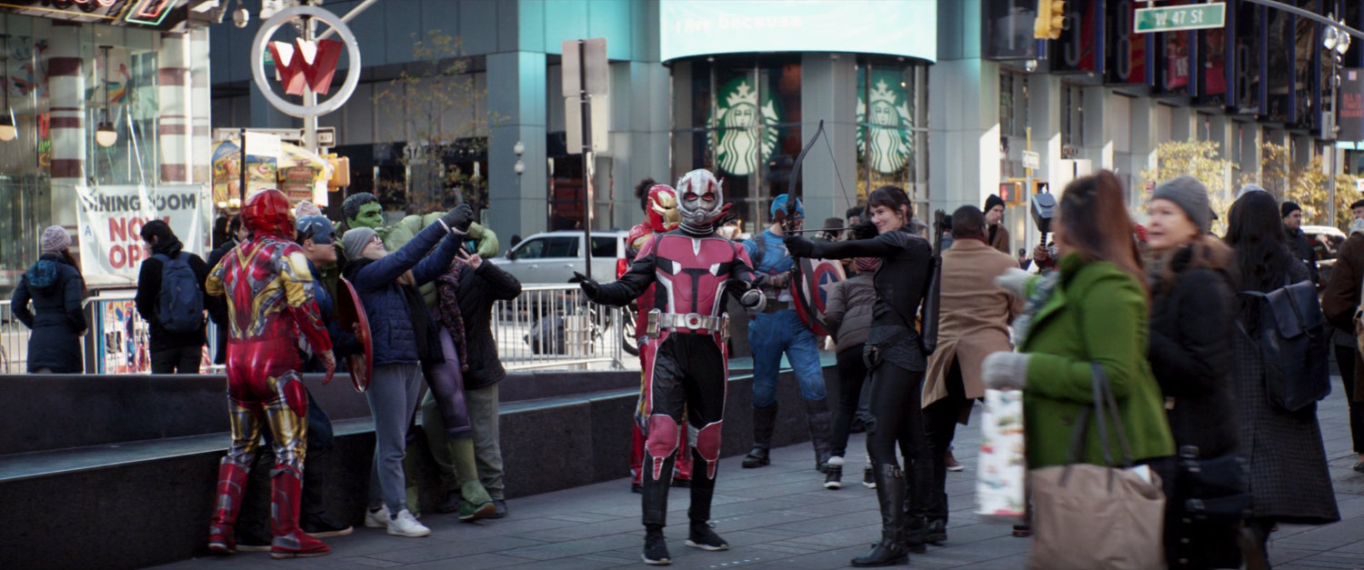 Actors posing as superheroes in Times Square.