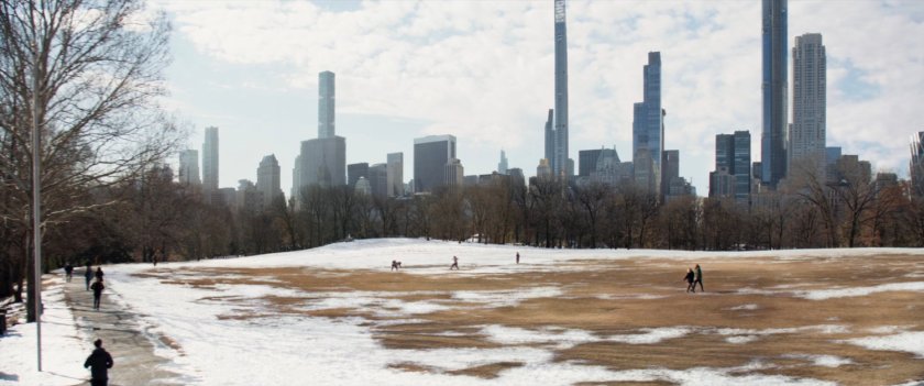 Clint walking on a path in Central Park.