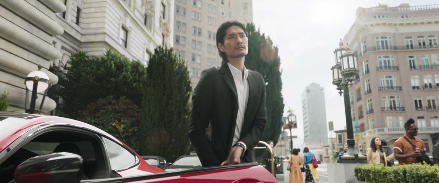 Close up of man getting out of car in front of Fairmont San Francisco hotel.