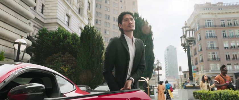 Close up of man getting out of car in front of Fairmont San Francisco hotel.