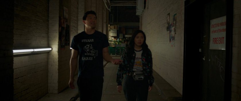 Shaun and Katy walk through an alley.