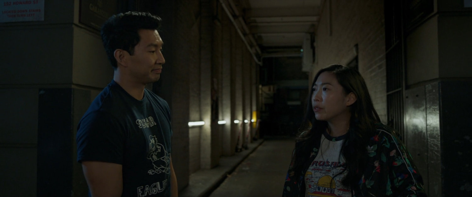 Shaun and Katy walk through an alley.