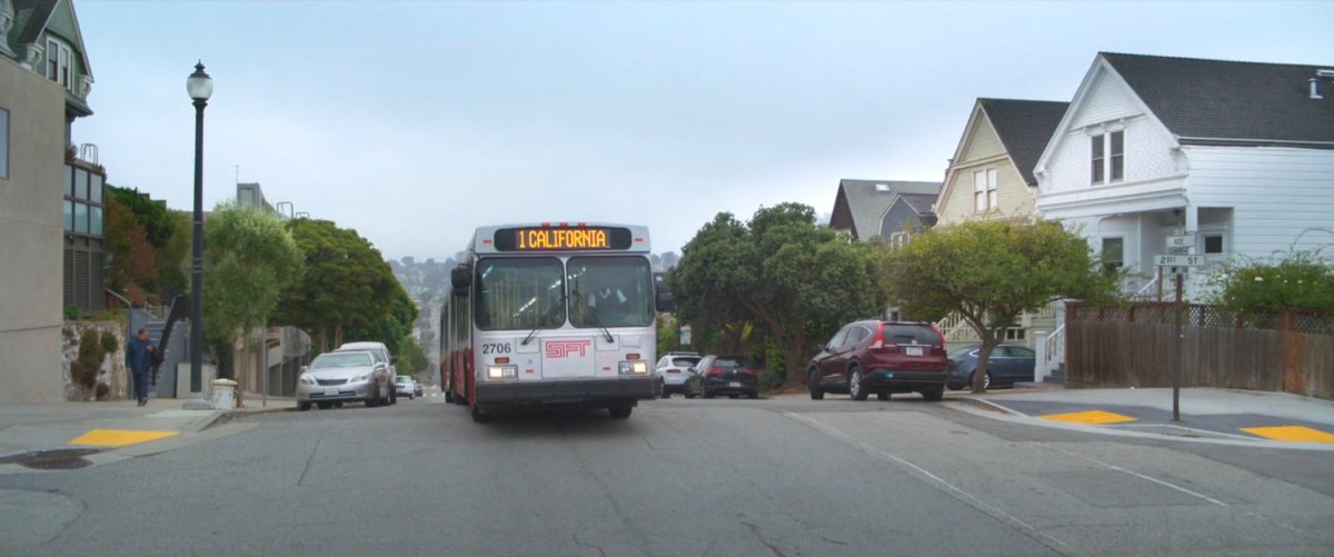 A San Francisco bus crests a hill.