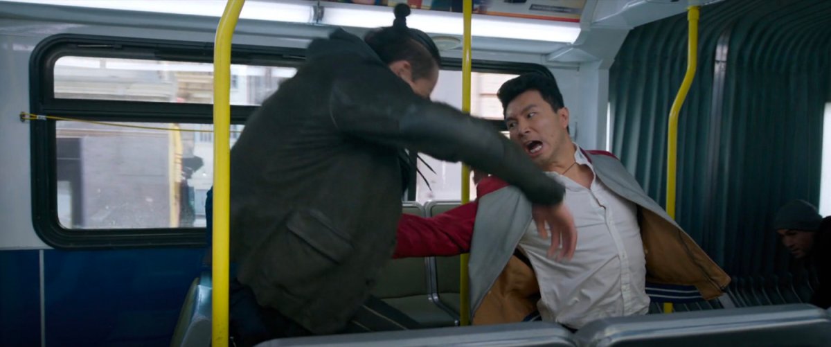 Shaun punches a thug in the stomach on a San Francisco metro bus.