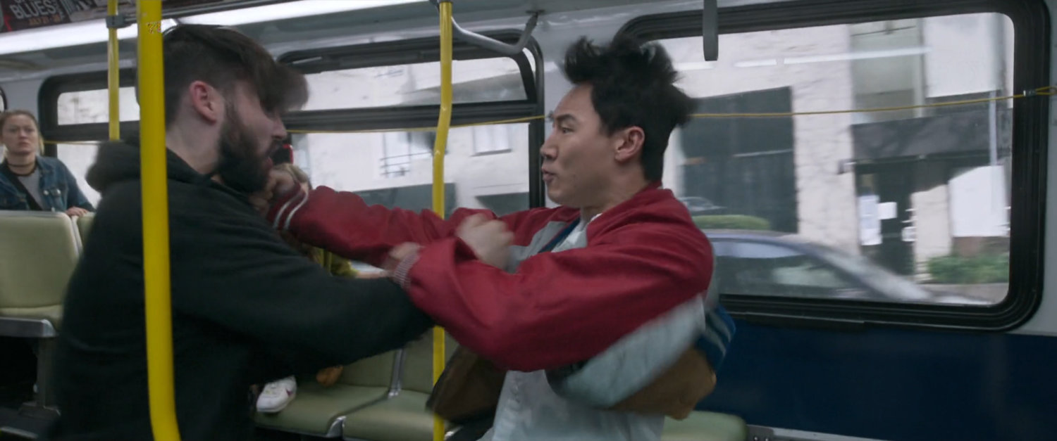 Shaun punches a couple bad guys on a San Francisco metro bus.
