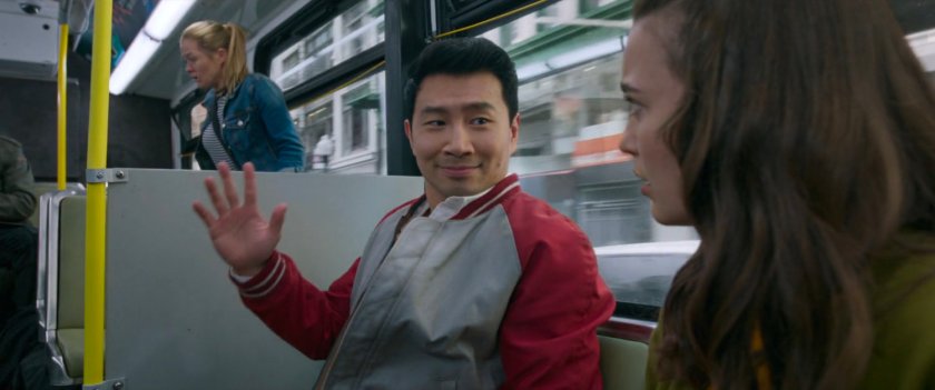 Shaun waves to a pretty woman on a San Francisco metro bus.