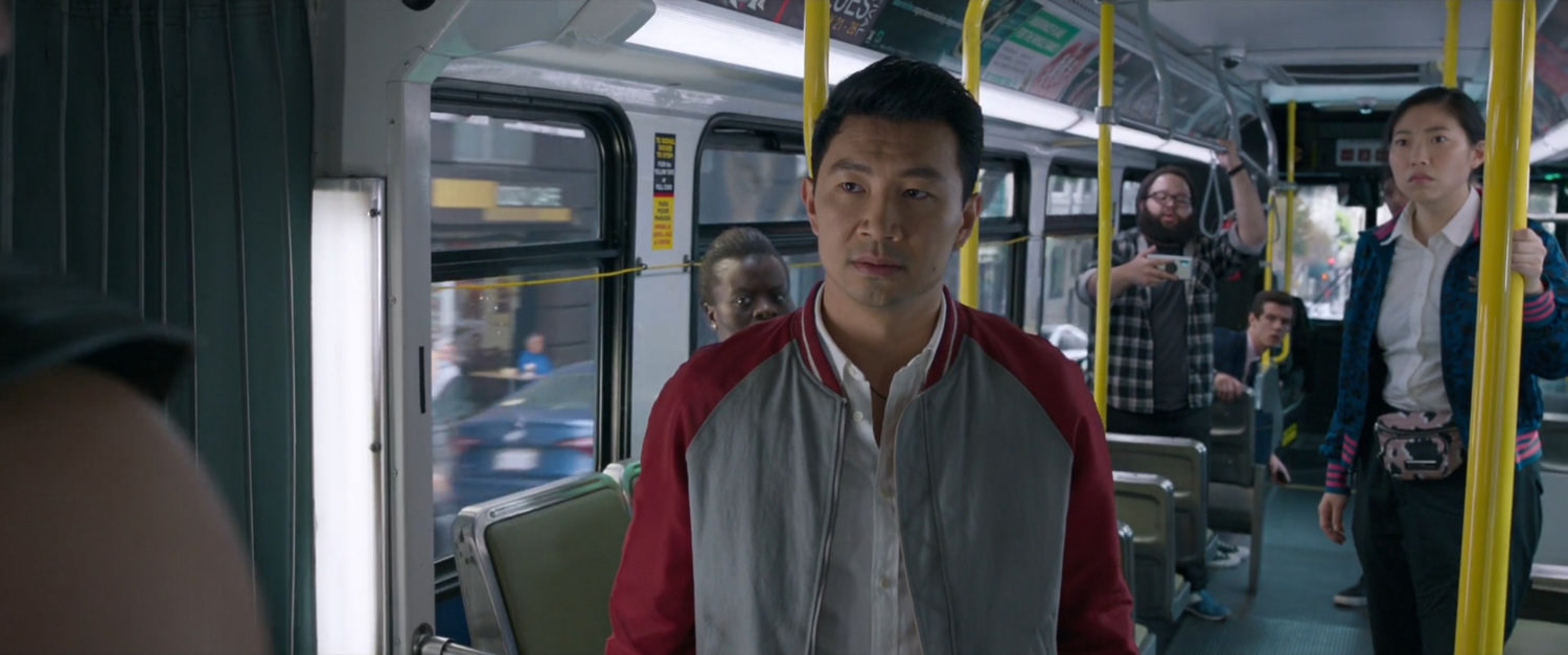 Shaun and onlookers on a San Francisco metro bus.