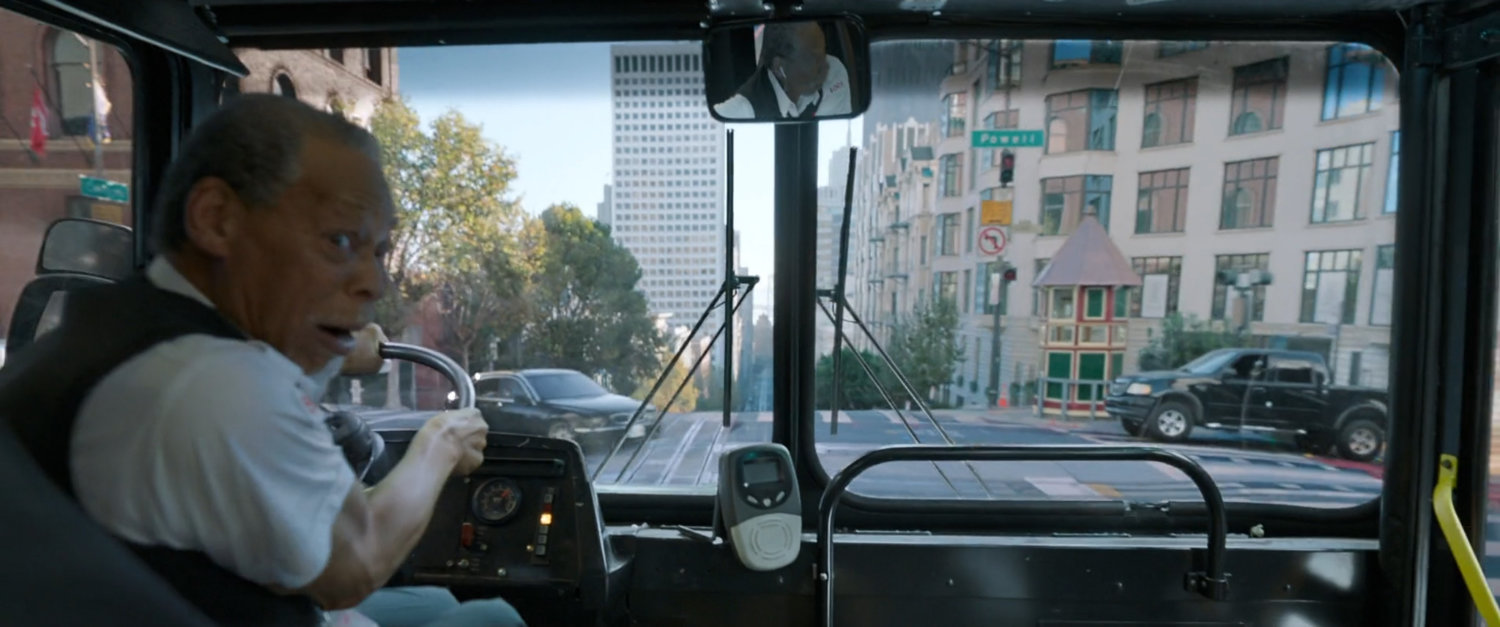 POV out the front of the bus as the driver looks back at the fight.