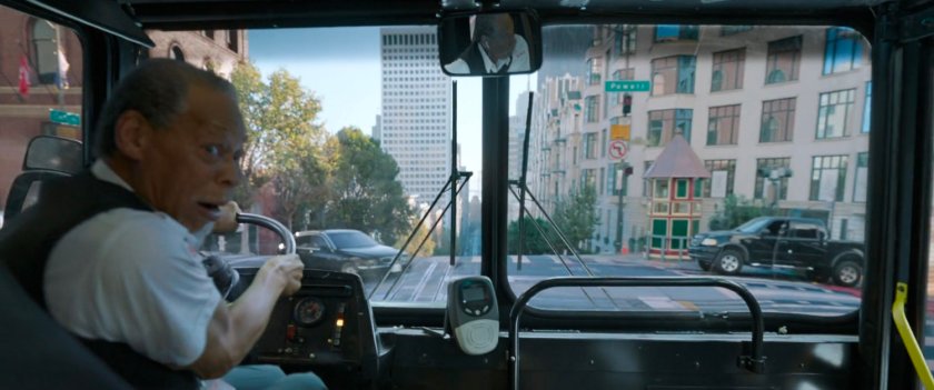 POV out the front of the bus as the driver looks back at the fight.